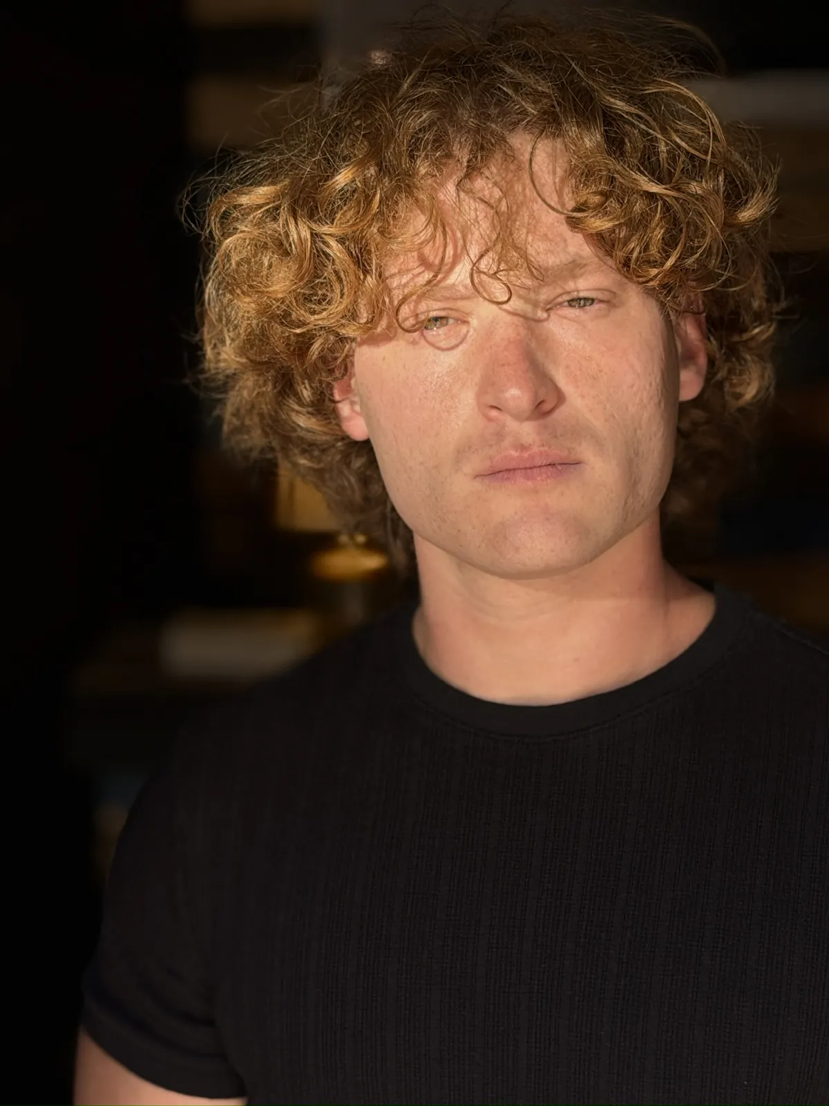 Three-quarter portrait in a black shirt