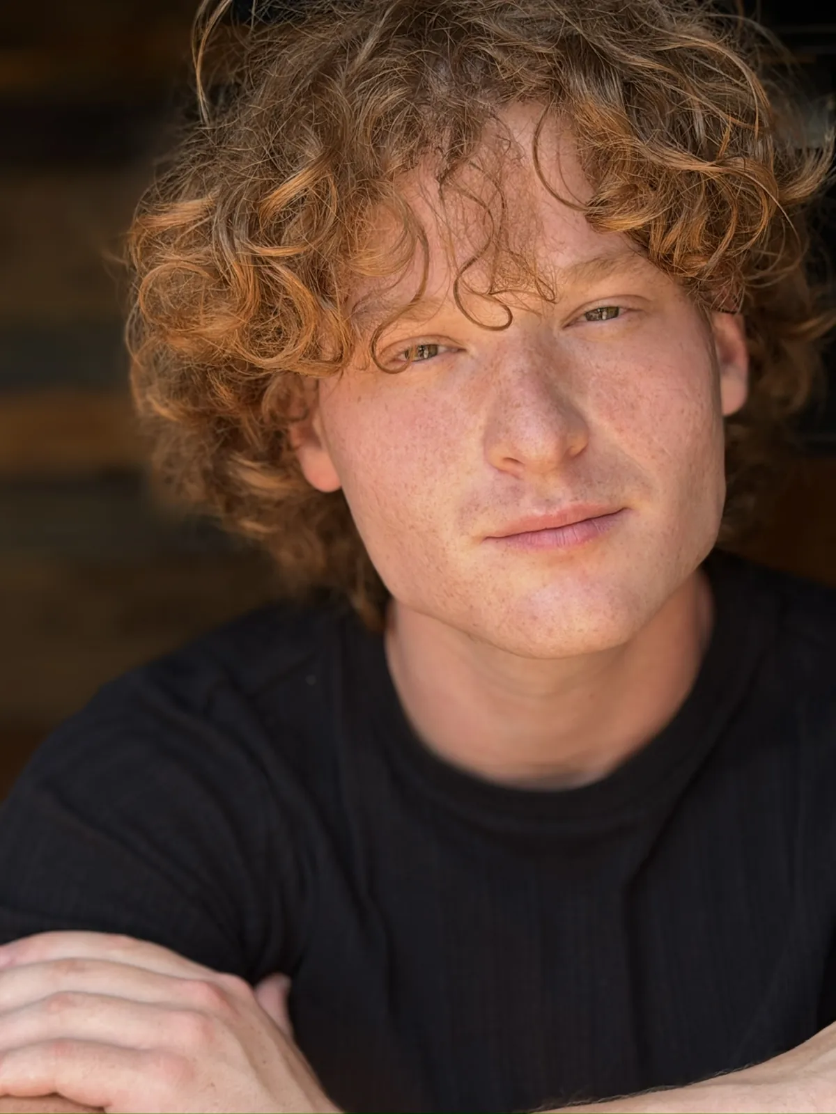 Warm close-up portrait in a black shirt